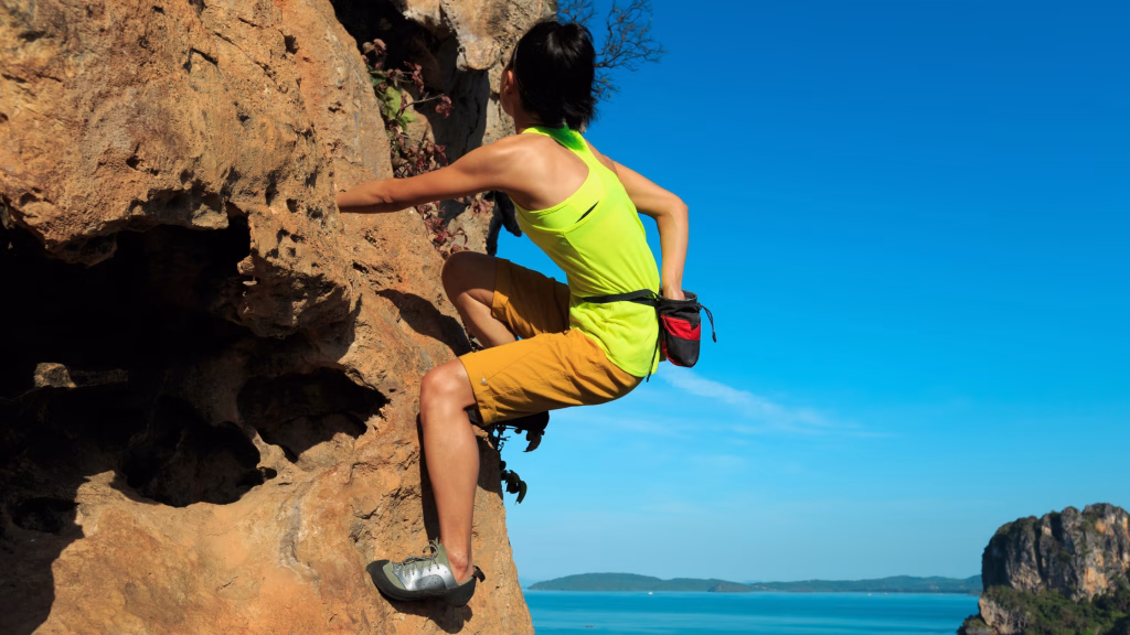 Woman cimbs steep rock face. | jacquiburke.com | Becuase It's Hard